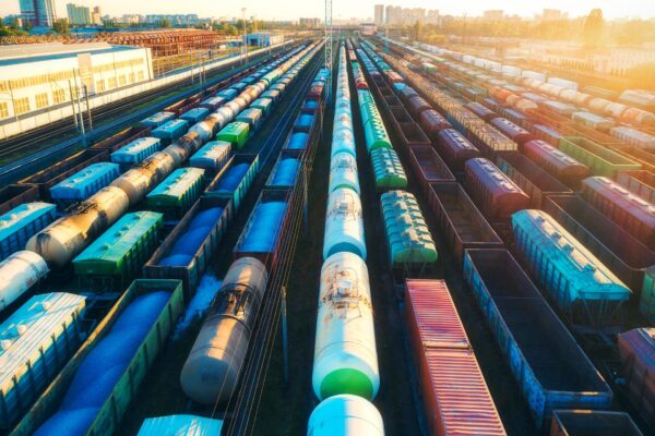 TRANSPORT KOLEJOWY aerial-view-of-colorful-freight-trains-on-railroad-2024-11-28-22-24-08-utc